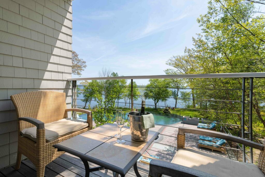 two chairs overlooking pool and ocean